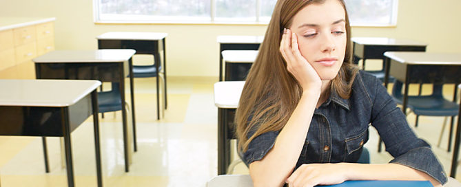 Teen high school student sleepy in school