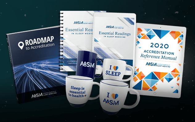 A collection of American Academy of Sleep Medicine accessories, including coffee mugs and reference manuals.